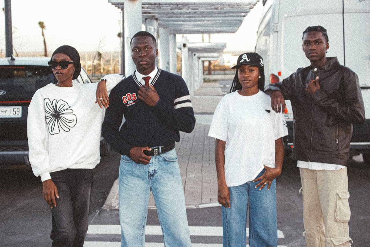 Services Group of fashionable young adults posing in an urban environment, showcasing casual streetwear style.
